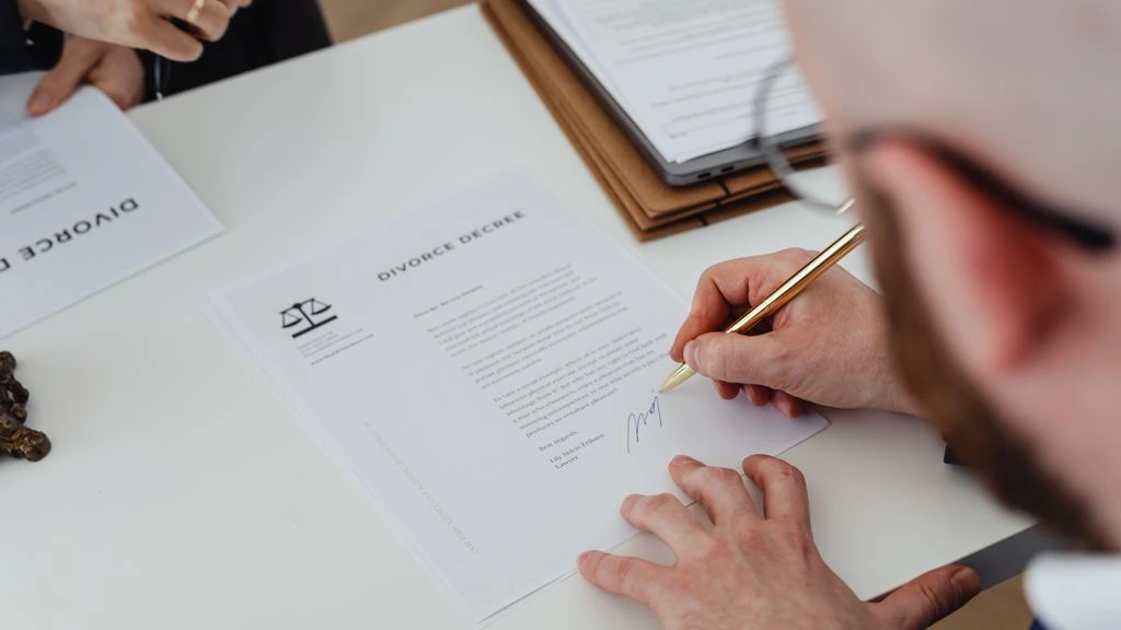 Aged legal documents under a desk lamp