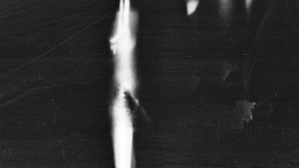 Scanned document spread on dark panel